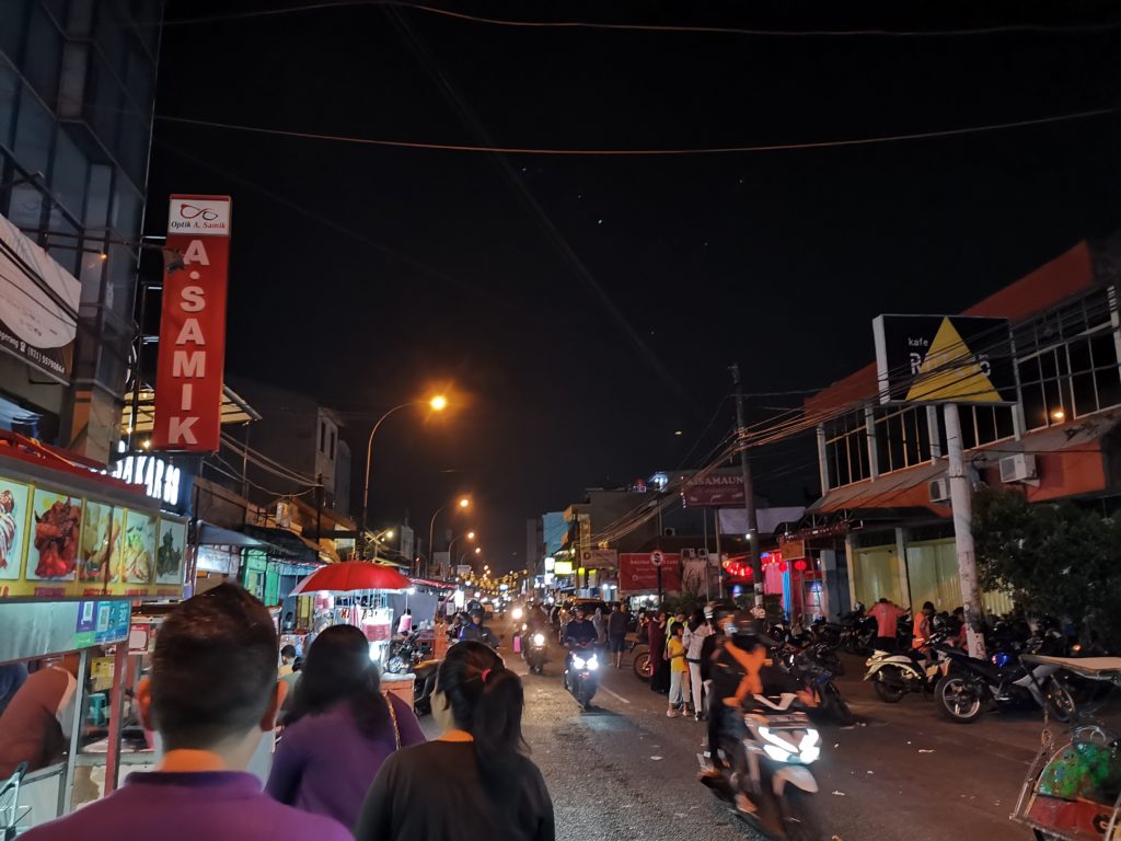 Nighttime scene in a busy community in Jakarta